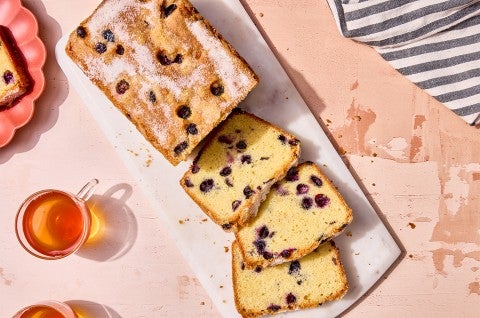 Blueberry Bread sliced on a cutting board - select to zoom