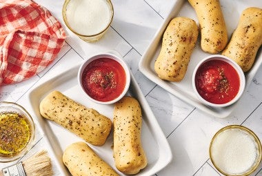 Cheese Stuffed Breadsticks arranged on plates.