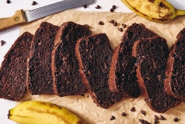 Double Chocolate Banana Bread sliced on a cutting board