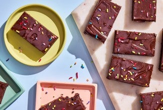 Easy Frosted Brownies served on plates and cutting board