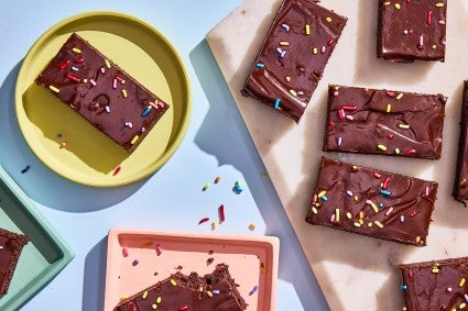 Easy Frosted Brownies served on plates and cutting board