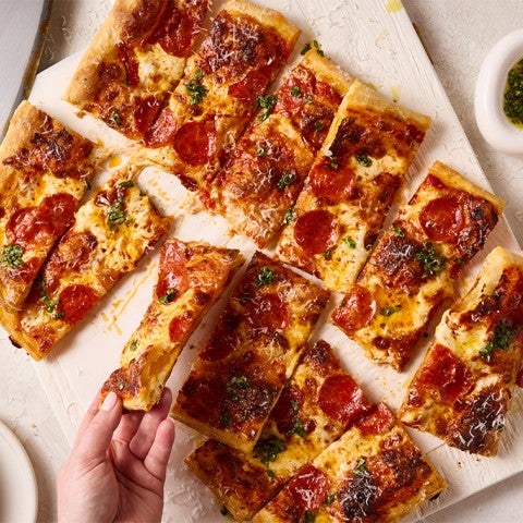 Pizza topped with pepperonis