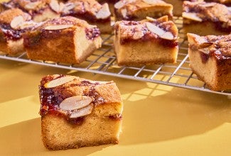 Raspberry Frangipane Bars sliced on a cooling rack