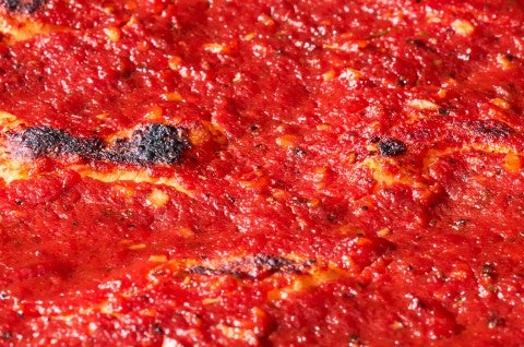 Detail shot of tomato topping on Rhode Island Pizza Strip. - select to zoom