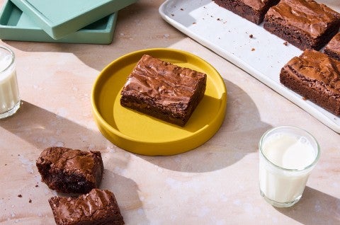 A Small-Batch Brownie on a plate with milk - select to zoom